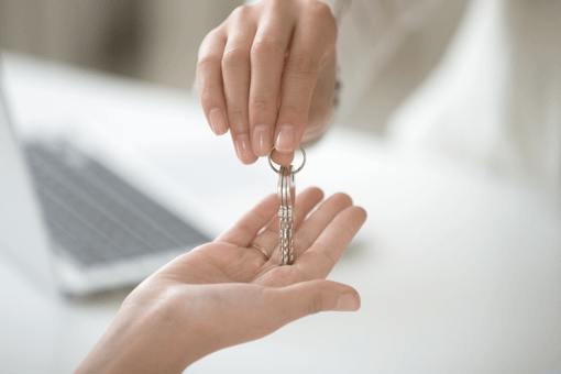 Estate agent gives keys to new landlord